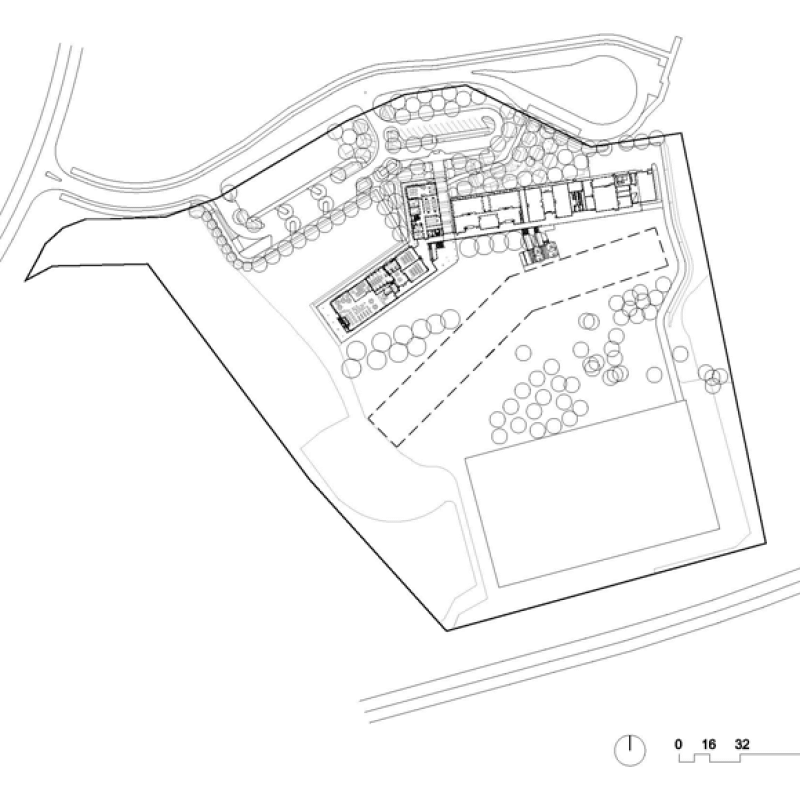 Cantilevered roofs sitting lantern-like atop the weightiness of a concrete block work-base, MacKillop Catholic College in the Northern Territory, roofing, wall cladding, soffits and flashing made from COLORBOND® steel in the colours Windspray®, Jasper®, and Shale Grey™